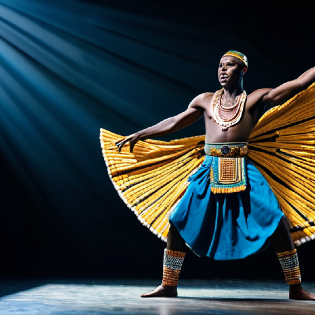 A dynamic Rwandan male dancer, mid-performance, showcasing the powerful Intore dance. He is fully clothed in elaborate, traditional Rwandan warrior attire, featuring intricate beadwork and flowing fabrics, professional dress, modest clothing. The setting is a professionally lit modern studio stage, with subtle, dramatic lighting highlighting his energetic movements. His pose is natural and expressive, capturing the raw energy and spirit of the dance. Perfect anatomy, correct proportions, well-formed hands, proper finger count, natural body proportions. This image is safe for work, appropriate content, and family-friendly, rendered as high-quality professional photography.
